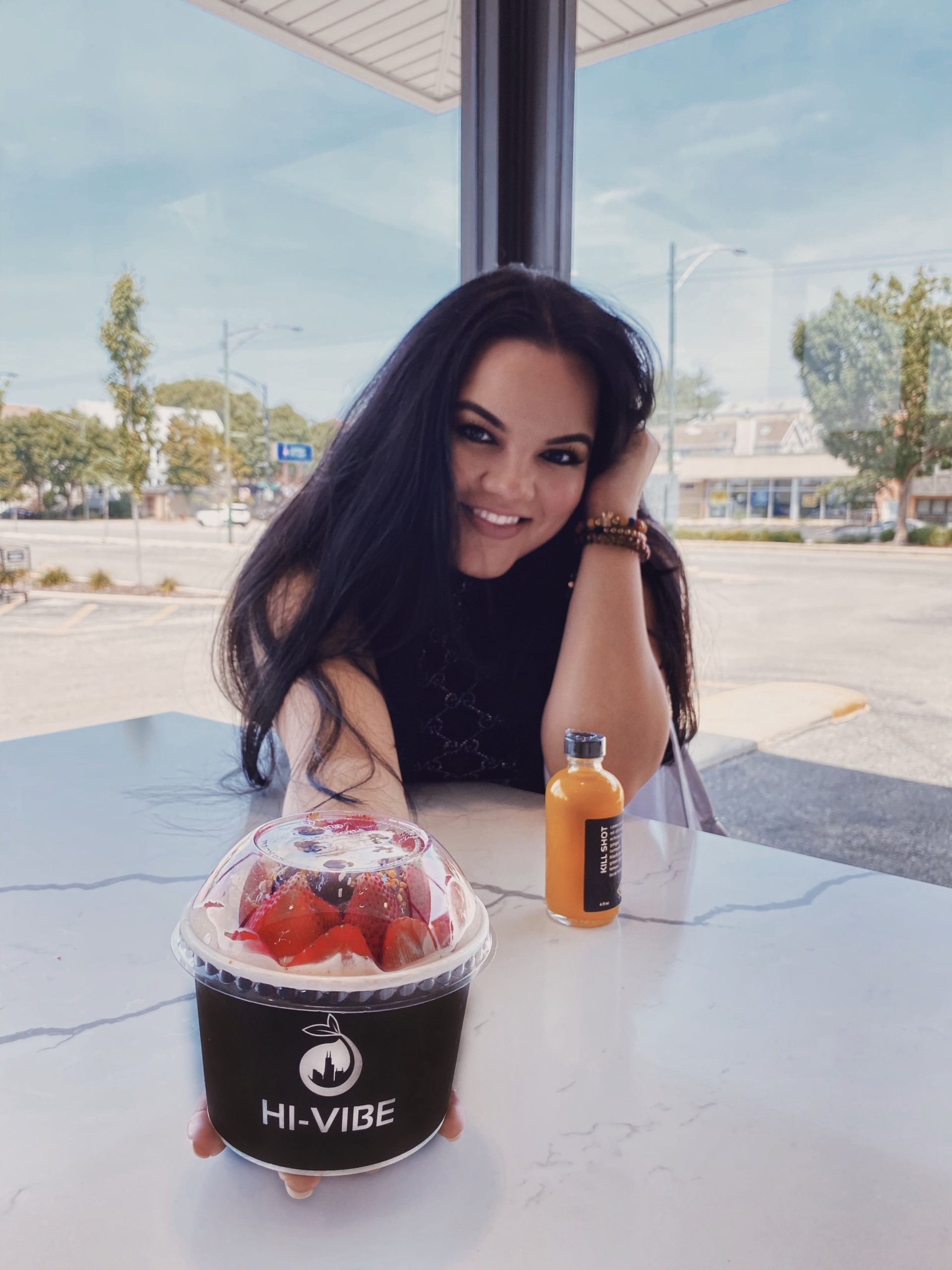 yessi bause posing with acai bowls
